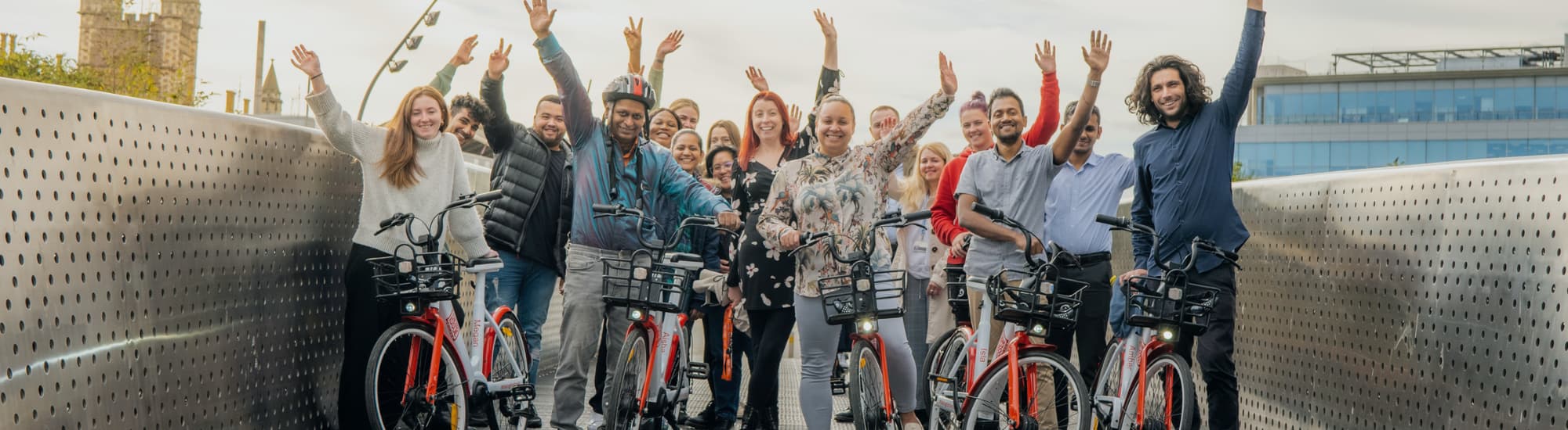 Group of people standing with bikes