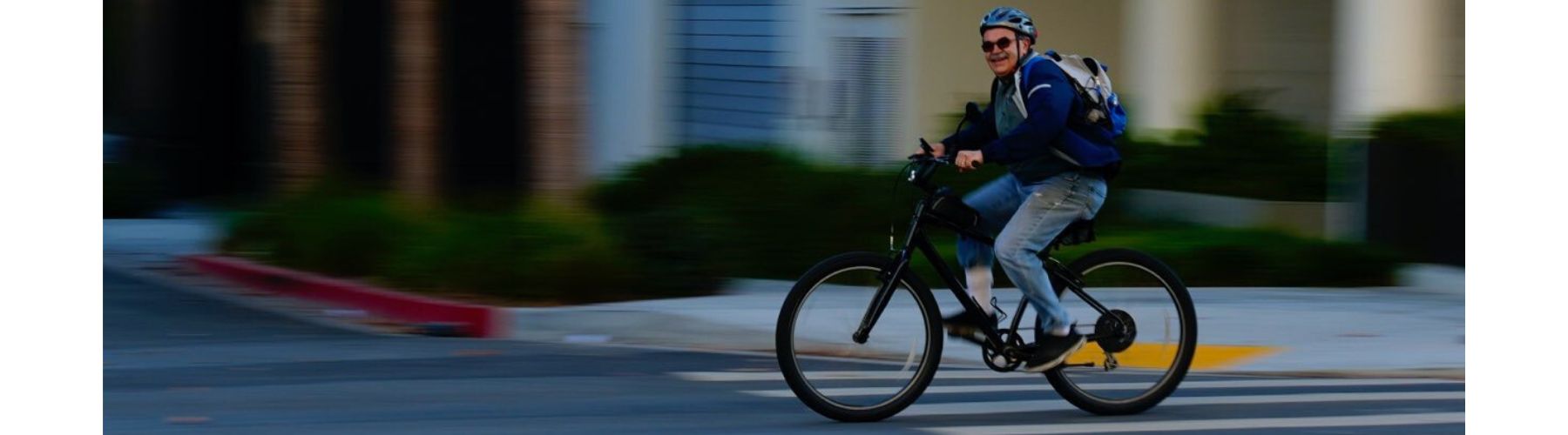 Happy man riding on his bike